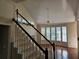 Elegant staircase with hardwood floors and railing at 821 Veranda Pl, Celebration, FL 34747