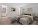 Comfortable bedroom with a queen-size bed and ensuite bathroom at 9818 Introduction Way, Orlando, FL 32832