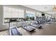 Bright fitness center featuring treadmills and ellipticals with pool views at 9818 Introduction Way, Orlando, FL 32832