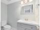 Updated bathroom with gray vanity and a new mirror at 1500 Gay Rd # 7A, Winter Park, FL 32789