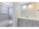 Updated bathroom with grey vanity and a shower/tub combo at 1500 Gay Rd # 7A, Winter Park, FL 32789