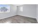 Spacious bedroom with wood-look floors and dual windows at 1500 Gay Rd # 7A, Winter Park, FL 32789