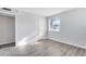 Well-lit bedroom with wood-look floors and a window at 1500 Gay Rd # 7A, Winter Park, FL 32789