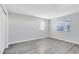 Bright bedroom with wood-look floors and large windows at 1500 Gay Rd # 7A, Winter Park, FL 32789