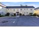 Condo building exterior showcasing a classic design and parking area at 1500 Gay Rd # 7A, Winter Park, FL 32789