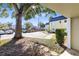 Landscaped front yard with mature trees and walkway at 1500 Gay Rd # 7A, Winter Park, FL 32789