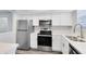 Modern kitchen featuring stainless steel appliances and white shaker cabinets at 1500 Gay Rd # 7A, Winter Park, FL 32789