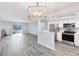 Open concept kitchen with stainless steel appliances and light grey vinyl flooring at 1500 Gay Rd # 7A, Winter Park, FL 32789