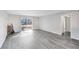 Open living area with grey vinyl flooring and sliding glass doors at 1500 Gay Rd # 7A, Winter Park, FL 32789