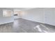 Bright living room featuring grey vinyl flooring and an open floor plan at 1500 Gay Rd # 7A, Winter Park, FL 32789