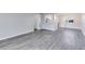 Spacious living room with grey vinyl flooring and an open layout at 1500 Gay Rd # 7A, Winter Park, FL 32789