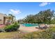 Community pool with lounge chairs and lush landscaping at 2209 Tipperary Ct # 1, Orlando, FL 32812