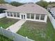 Aerial view of home's backyard, showing patio and landscaping at 2485 Huron Cir, Kissimmee, FL 34746