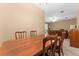 Bright dining room with a wood table and chairs, near the kitchen at 309 Coral Beach Cir, Casselberry, FL 32707
