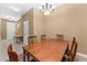 Spacious dining area with a wood table and access to the entryway at 309 Coral Beach Cir, Casselberry, FL 32707