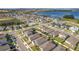 Aerial view showing a neighborhood's layout near a lake at 3288 Sailing Pier Ave, Winter Garden, FL 34787