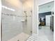 Spacious shower with glass doors and modern tile design at 3288 Sailing Pier Ave, Winter Garden, FL 34787