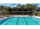 Resort-style pool with lounge chairs and clubhouse in background at 409 N Plantation Blvd, Lake Mary, FL 32746