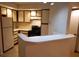 Kitchen with light wood cabinets and appliances at 4572 Commander Dr # 1227, Orlando, FL 32822