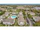 Wide aerial view of the community, highlighting the pool and surrounding buildings at 5269 Wellington Park Cir # 23, Orlando, FL 32839