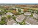 Community view with pond and surrounding landscape at 5269 Wellington Park Cir # 23, Orlando, FL 32839