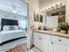Modern bathroom with granite countertops and white cabinets at 5269 Wellington Park Cir # 23, Orlando, FL 32839