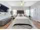 Spacious bedroom with a king-size bed and hardwood floors at 5269 Wellington Park Cir # 23, Orlando, FL 32839