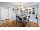 Bright dining room showcasing a wine rack and chandelier at 5269 Wellington Park Cir # 23, Orlando, FL 32839