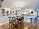 Elegant dining room with wine storage and hardwood floors at 5269 Wellington Park Cir # 23, Orlando, FL 32839