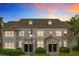 Attractive two-story townhome with a charming front porch and landscaping at 5269 Wellington Park Cir # 23, Orlando, FL 32839