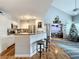 Open kitchen features granite countertops, stainless steel appliances, and a breakfast bar at 5269 Wellington Park Cir # 23, Orlando, FL 32839