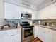 Well-equipped kitchen, granite counters, stainless steel appliances at 5269 Wellington Park Cir # 23, Orlando, FL 32839