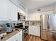 Modern kitchen with stainless steel appliances and granite countertops at 5269 Wellington Park Cir # 23, Orlando, FL 32839