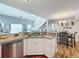 Open concept kitchen with granite countertops and stainless steel appliances at 5269 Wellington Park Cir # 23, Orlando, FL 32839