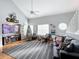 Spacious living room with hardwood floors, a fireplace, and a Christmas tree at 5269 Wellington Park Cir # 23, Orlando, FL 32839