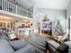 Open concept living space with a high ceiling and loft area at 5269 Wellington Park Cir # 23, Orlando, FL 32839