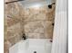 Updated shower with tile surround and built-in seat at 5269 Wellington Park Cir # 23, Orlando, FL 32839