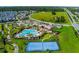 Aerial view of community amenities including pool and tennis at 12128 Illustration Dr, Orlando, FL 32832