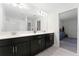 Double vanity bathroom with view to bedroom at 12128 Illustration Dr, Orlando, FL 32832