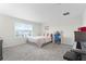 Bedroom with queen bed, dresser and keyboard at 12128 Illustration Dr, Orlando, FL 32832