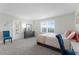 Main bedroom with large bed, dresser, and window at 12128 Illustration Dr, Orlando, FL 32832