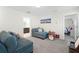 Bedroom with chaise lounge, drum set, and view of bathroom at 12128 Illustration Dr, Orlando, FL 32832
