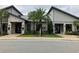 Community clubhouse with stone and gray siding at 12128 Illustration Dr, Orlando, FL 32832