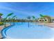 Resort-style pool with palm trees and a fun water feature for  at 12128 Illustration Dr, Orlando, FL 32832