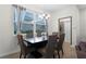 Bright dining room with table and chairs near window at 12128 Illustration Dr, Orlando, FL 32832