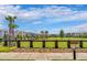 Community dog park with fenced area and bench at 12128 Illustration Dr, Orlando, FL 32832