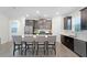 Modern kitchen with dark cabinetry and large island at 12128 Illustration Dr, Orlando, FL 32832