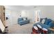 Spacious loft area with two comfy sofas at 12128 Illustration Dr, Orlando, FL 32832