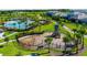 Community playground with play structures and shaded areas at 12128 Illustration Dr, Orlando, FL 32832
