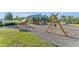 playground with swings and play structures at 12128 Illustration Dr, Orlando, FL 32832